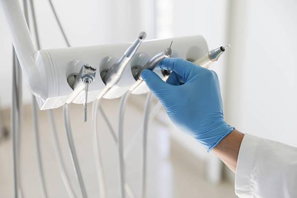 Professional Tooth Extraction technician working in Eau Claire, WI
